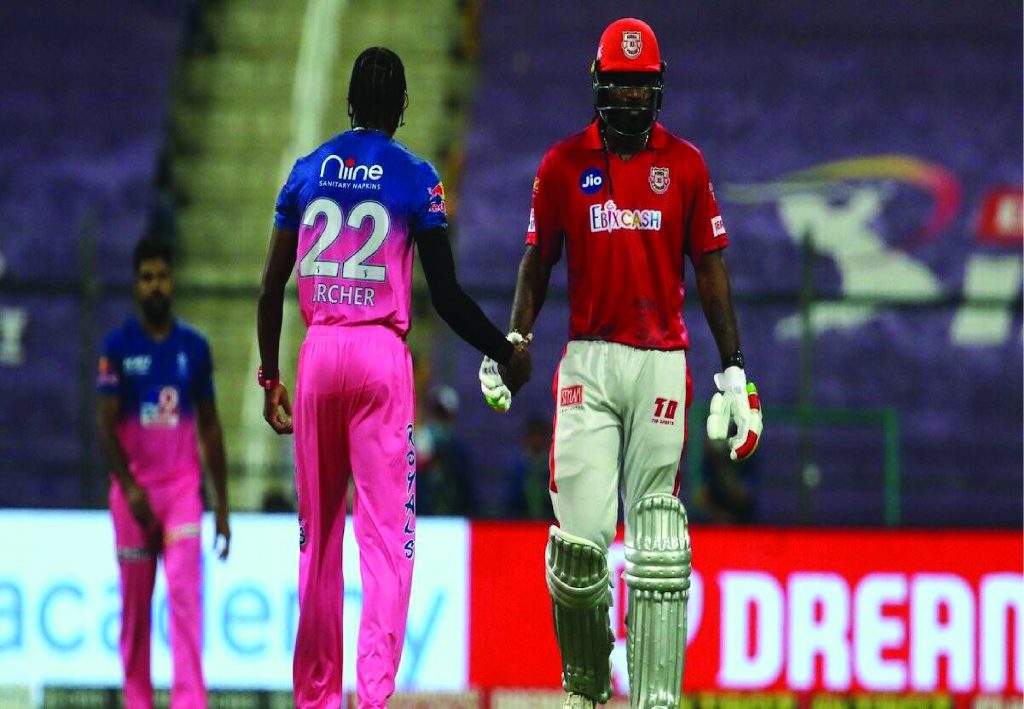 Chris Gayle and Jofra Archer shaking hands.