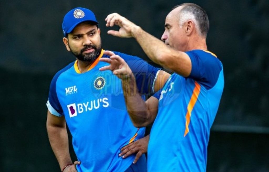 Caption Rohit Sharma batting practice discussion with coach